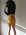 Tył spódnicy Giallo - Modelka o wzroście 175 cm ma na sobie rozmiar L